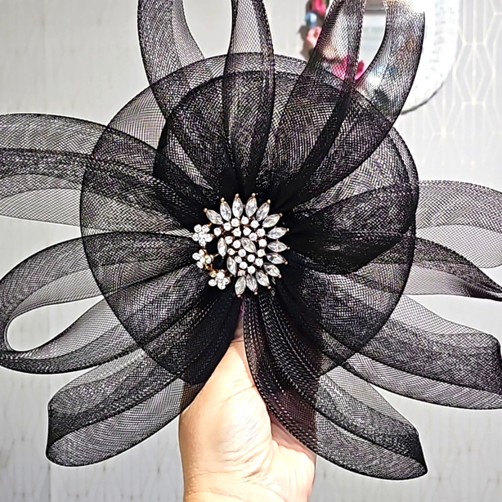Vintage black hat, crystal brooch. Light fabric.